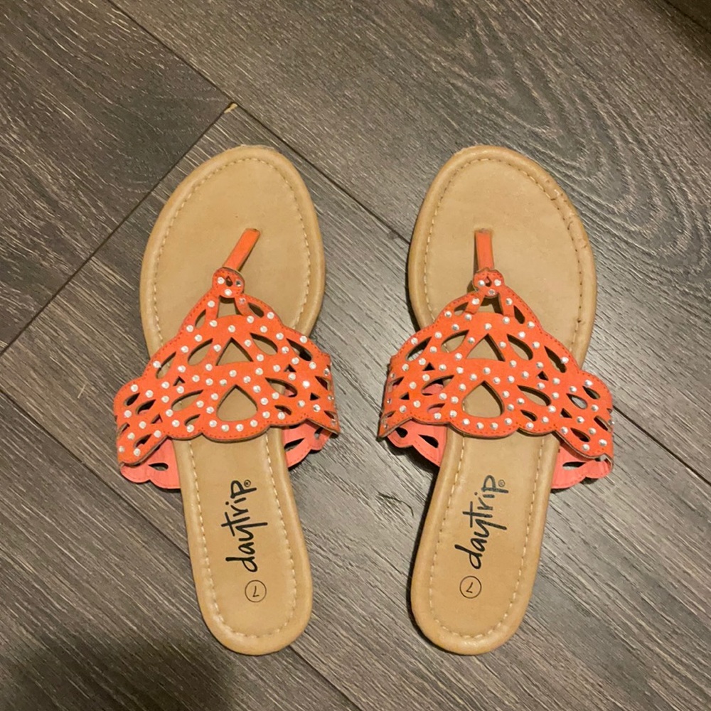 Coral sandals with rhinestones.